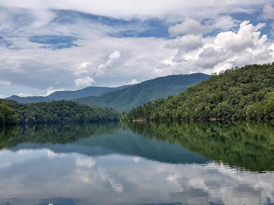Water's Edge, Covered Porch, Deep Creek as your Backyard Haven, Hot Tub, Pool Table, Fire Pit, Close to Town & Entrance to National Park